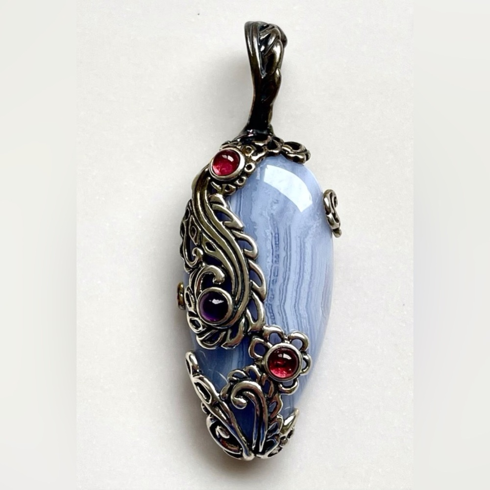 Carolyn Pollack: light blue oval shaped silver strong enhancer